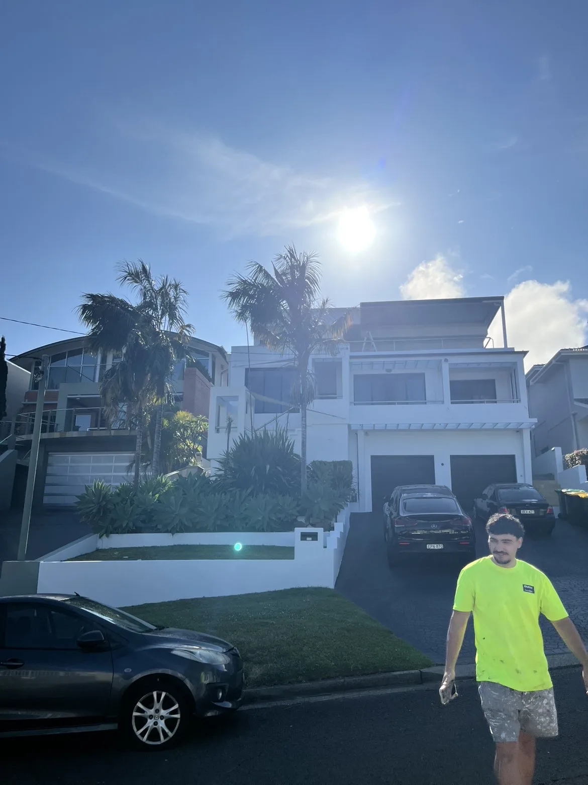 Completed white coastal home exterior repaint