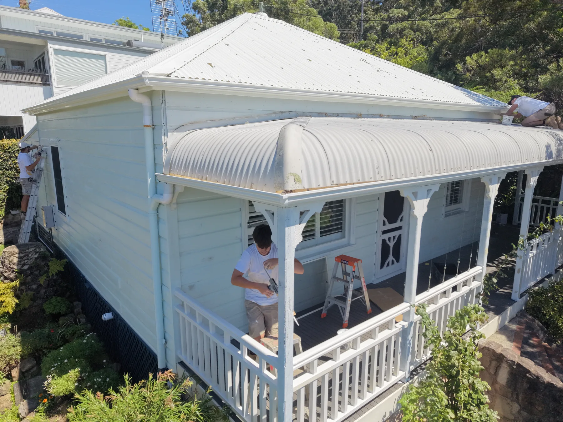 Detailed exterior painting work on a weatherboard veranda